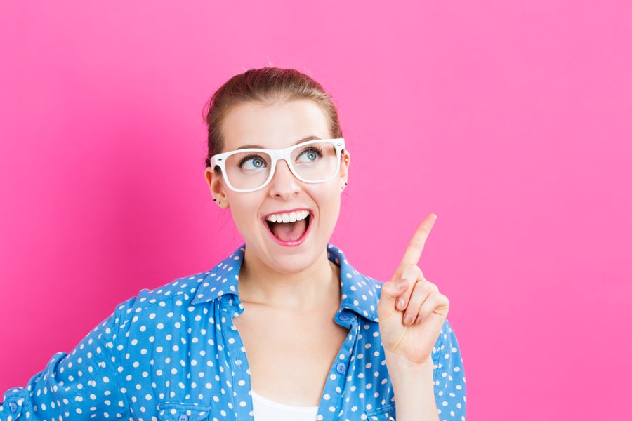 Woman smiling and pointing