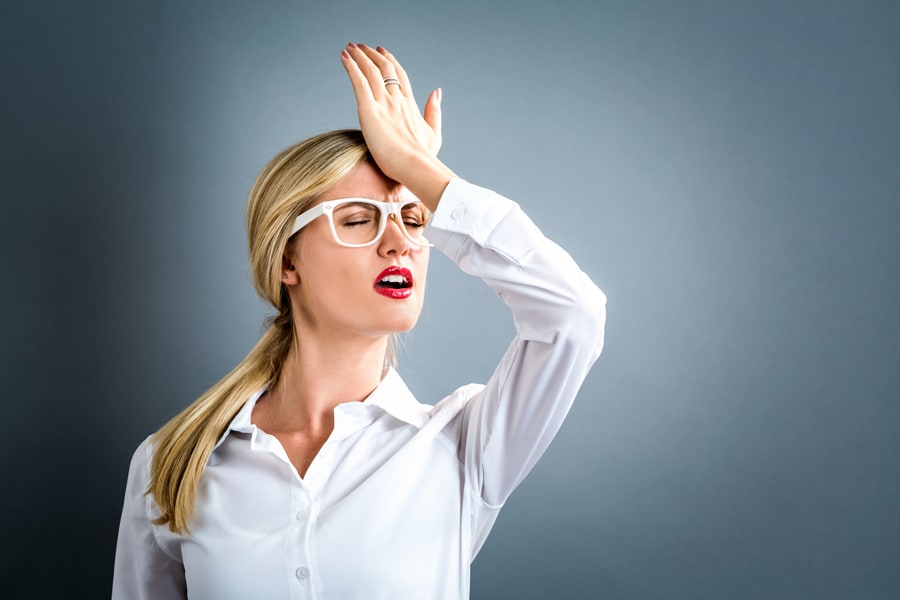 Woman smacking her forehead